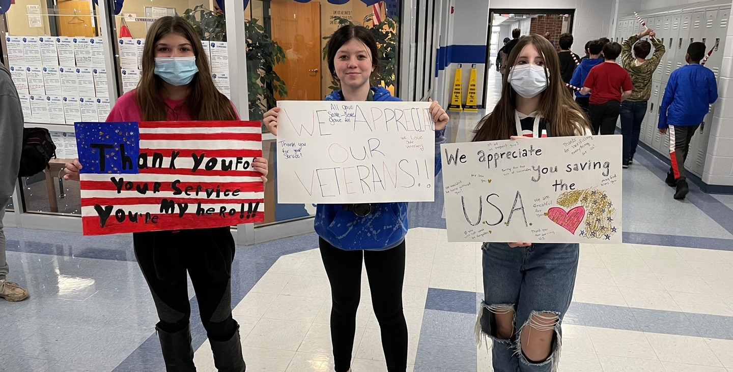 CMS students with signs they created