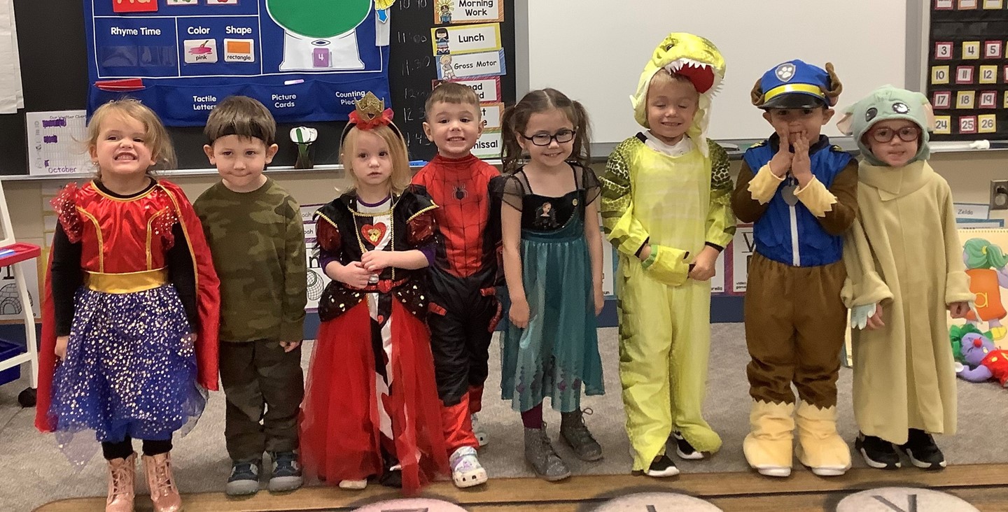 Preschool students in Halloween costumes