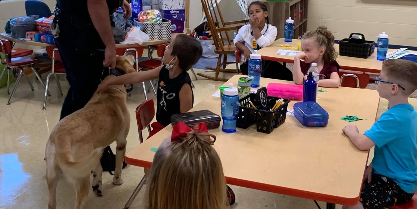 Jota the K9 visits students