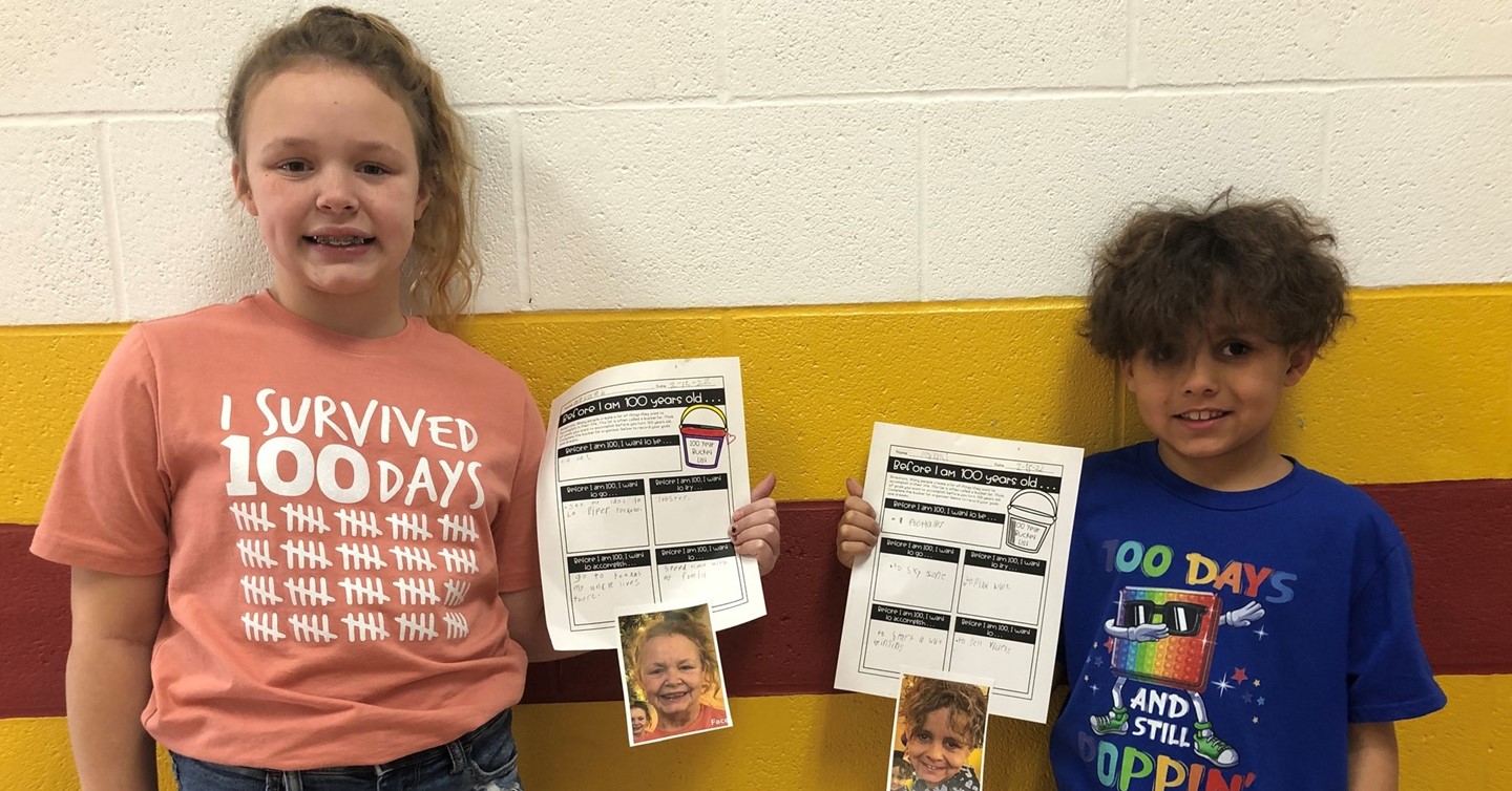100th Day of School with two students with appropriate tshirts