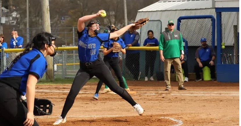 Bobcat softball players pitching